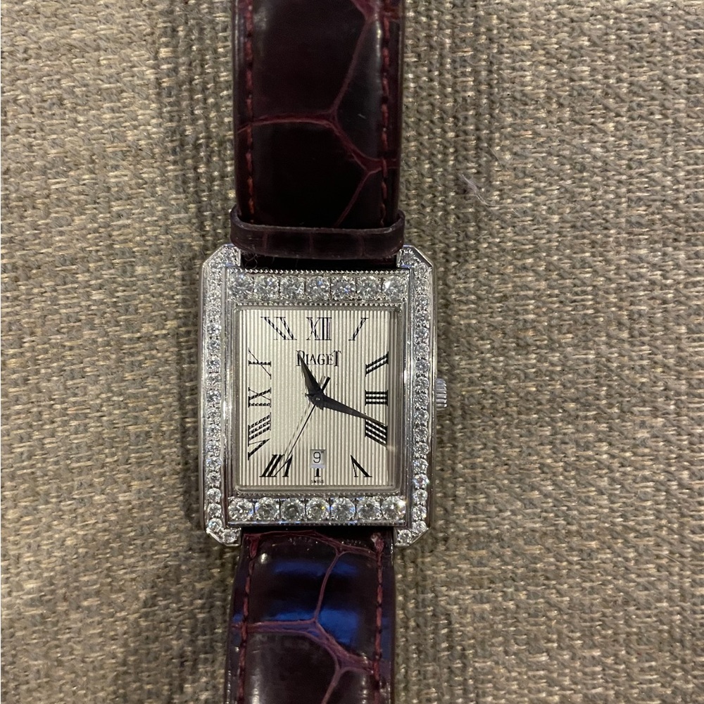 Piaget 18k gold with factory diamond bezel.